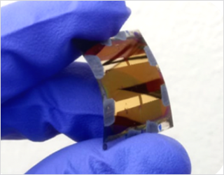 Figure 1: A curved perovskite photovoltaic cell on ultra-thin flexible glass